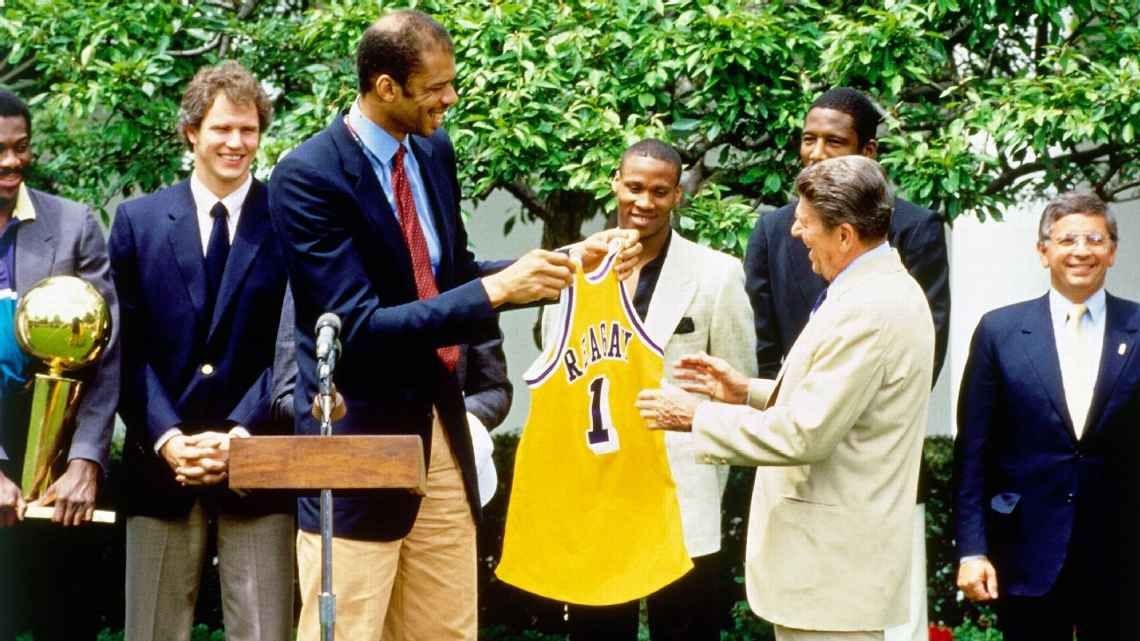 Kareem Abdul-Jabbar presented President Ronald Reagan with a personalized Los Angeles Lakers jersey at the White House