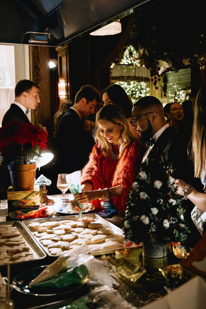 Focused concentration as another cookie masterpiece takes shape—some perfectly precise, others delightfully chaotic, all made with holiday spirit.