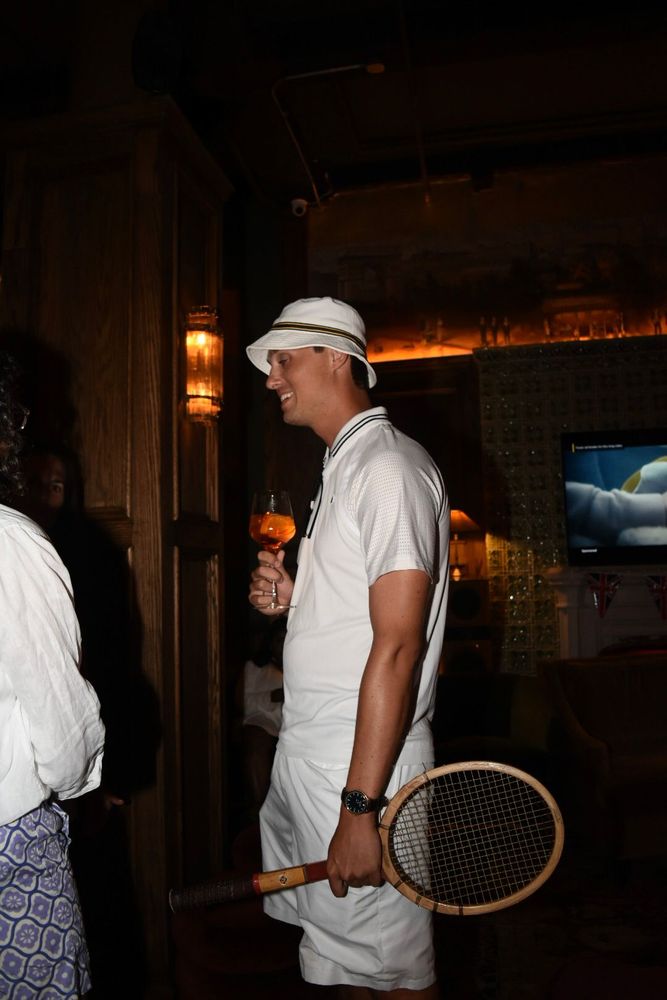 Tennis-inspired outfits and racquets were part of the visual story throughout the night