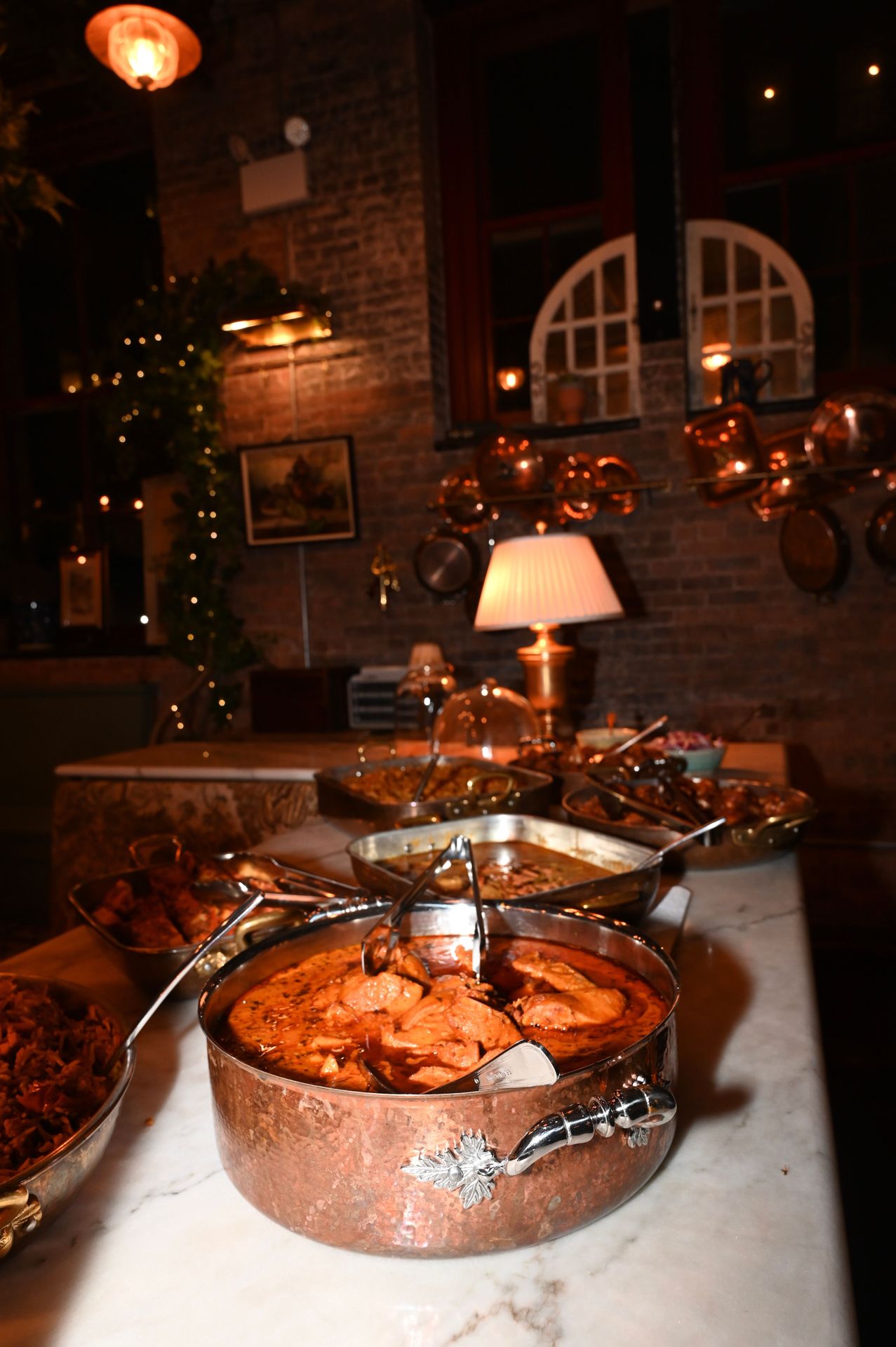 Our communal kitchen is where the magic happens. Fresh ingredients, copper pots, and enough charm to make your team forget they're at a work event