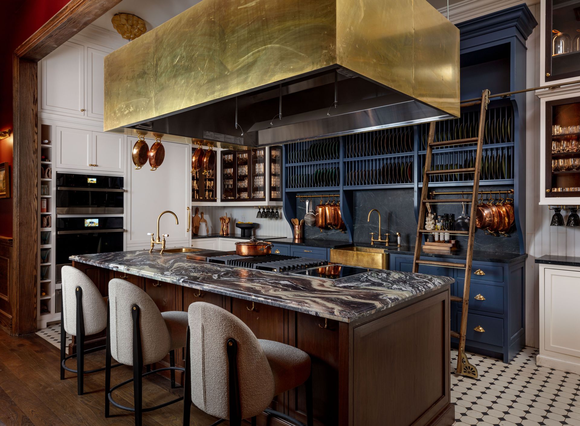 A fully outfitted JennAir kitchen with custom cabinetry, open shelving, and our signature ladder. Designed for real cooking and real gatherings.