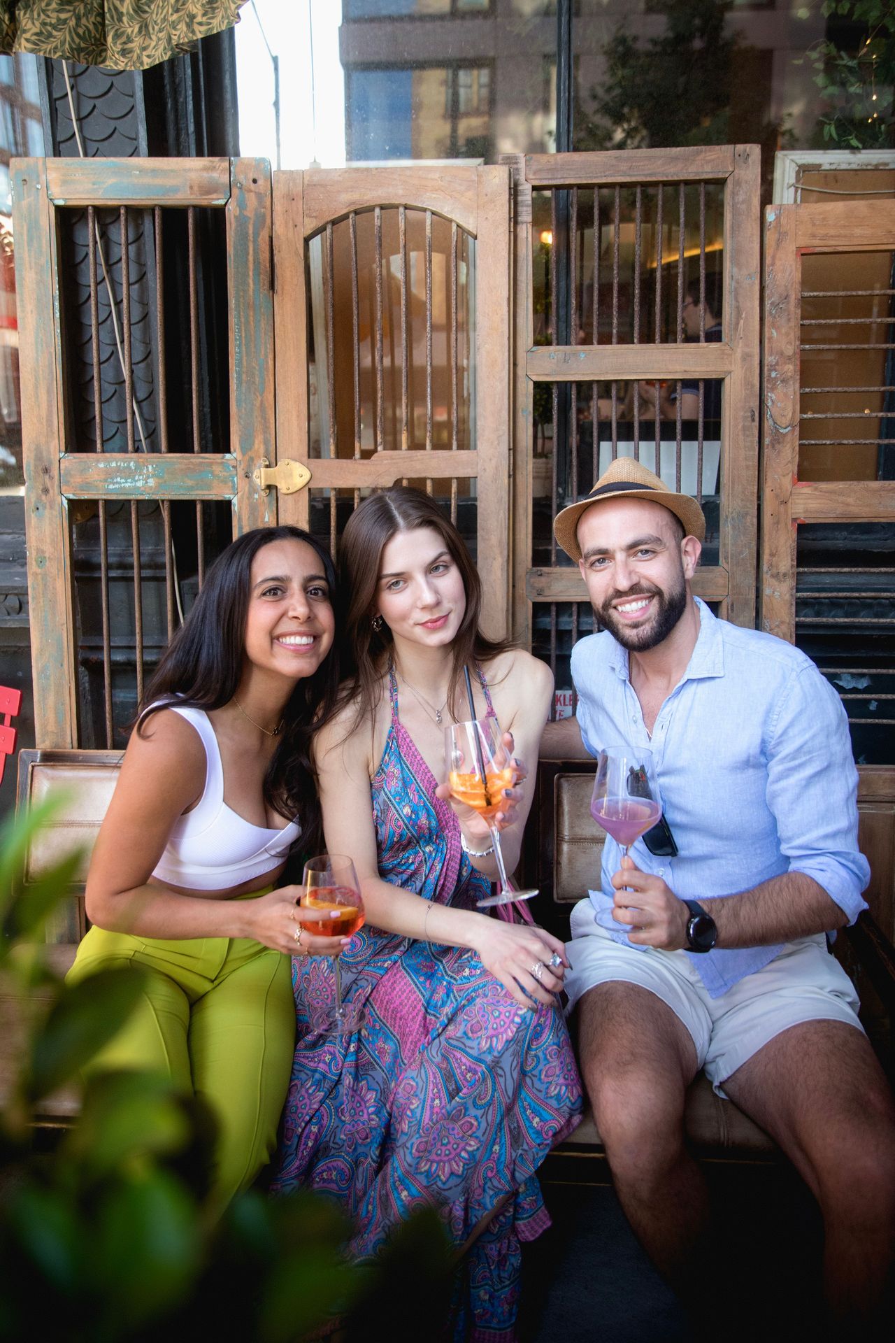 Guests gathered on the terrace, their colorful drinks matching the sunset glow
