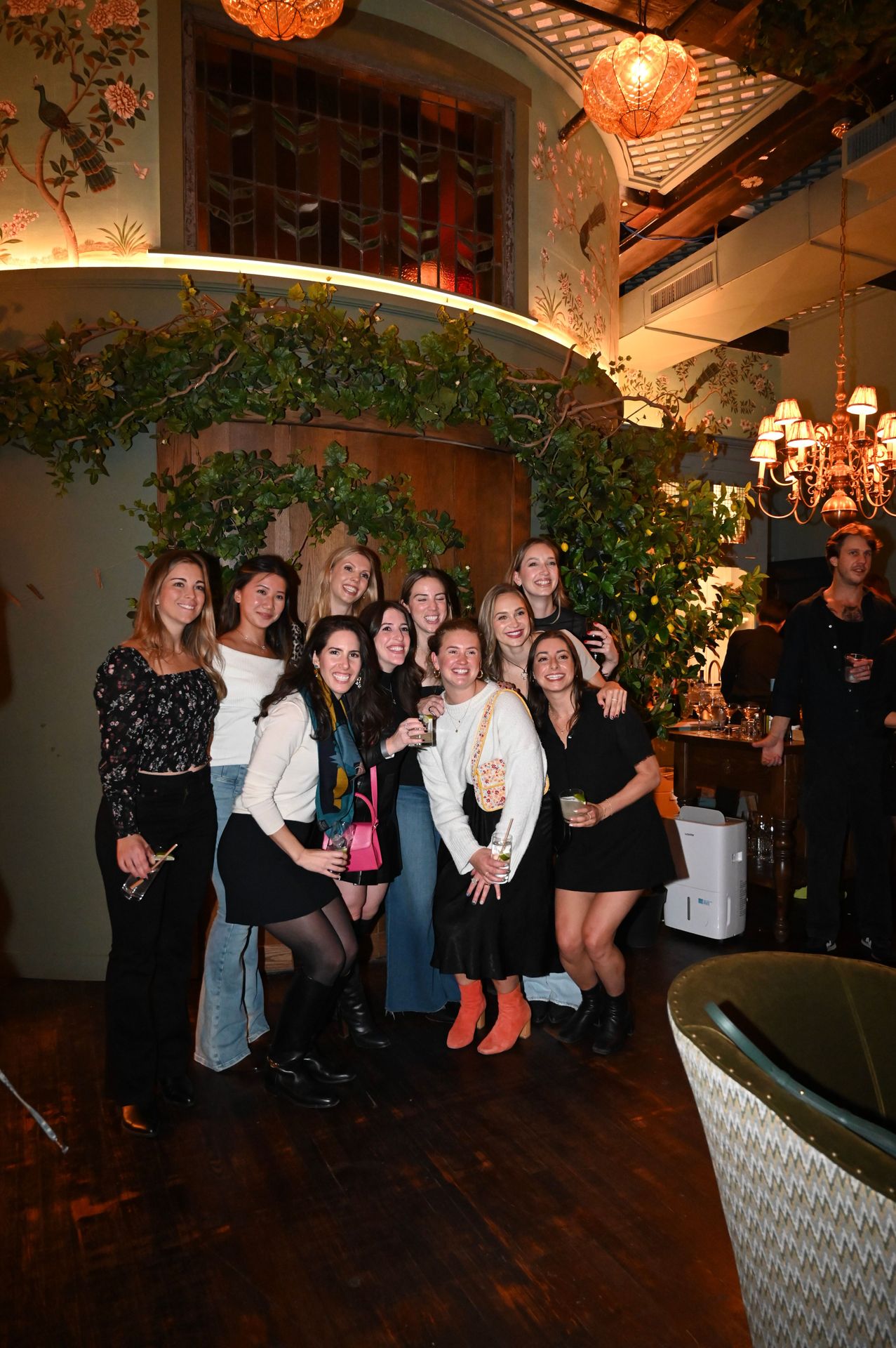 Group photo spot. The hand-painted wallpaper and vintage lighting make everyone look better