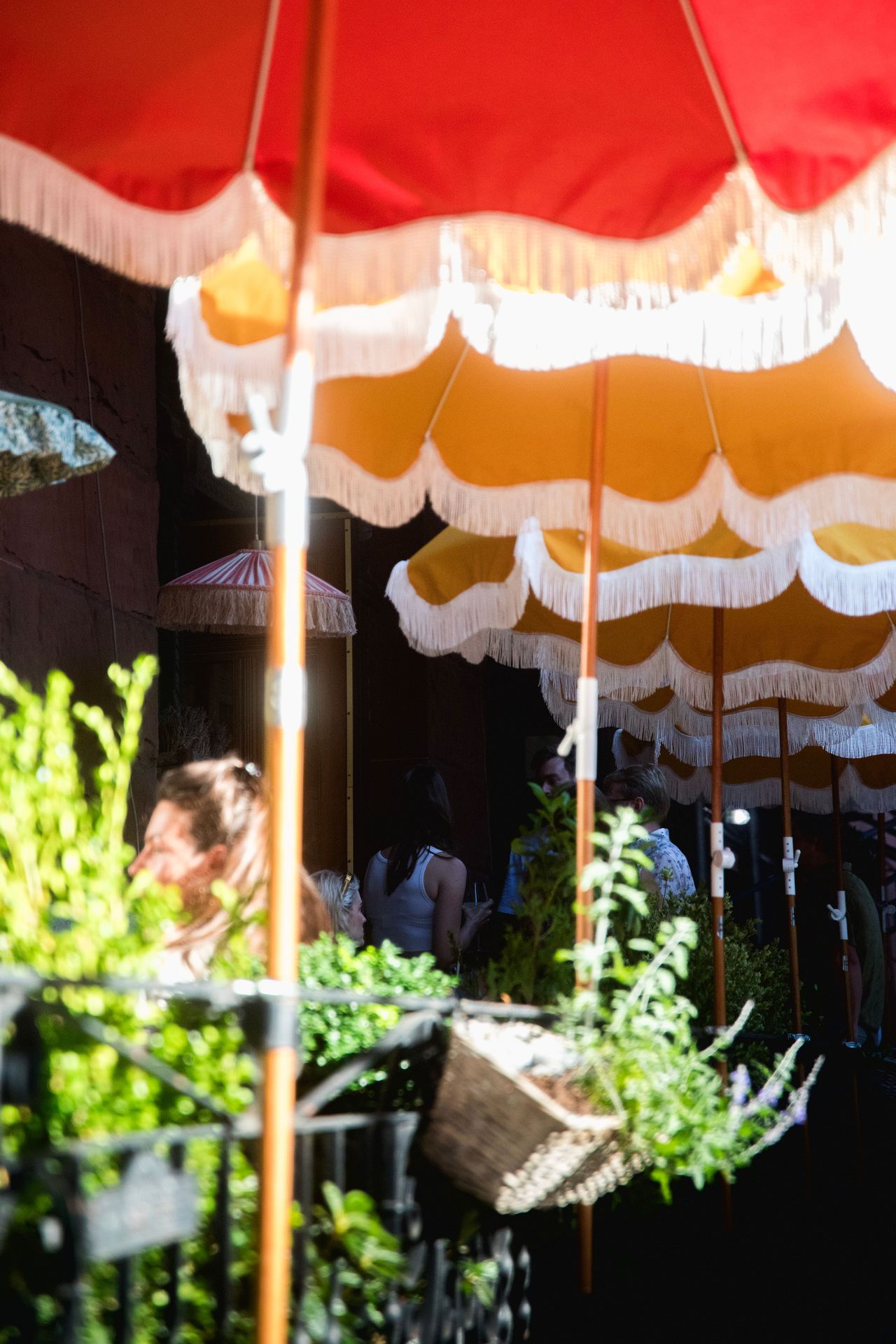 A closer look at the terrace blooms and umbrellas that set the Riviera scene