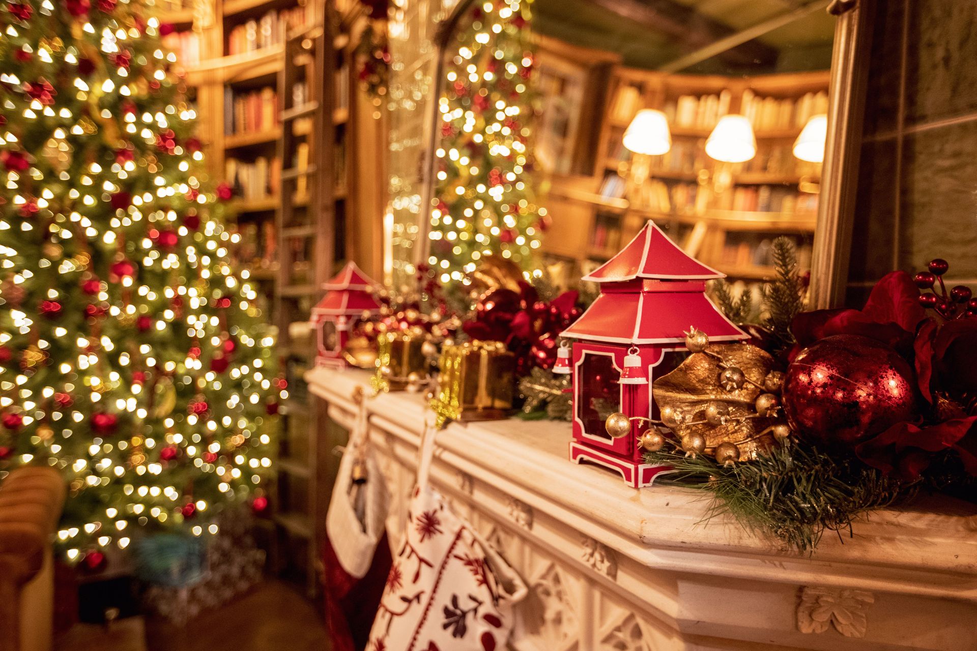 Stockings, ornaments, and tiny houses lined the mantle like a scene from a storybook.