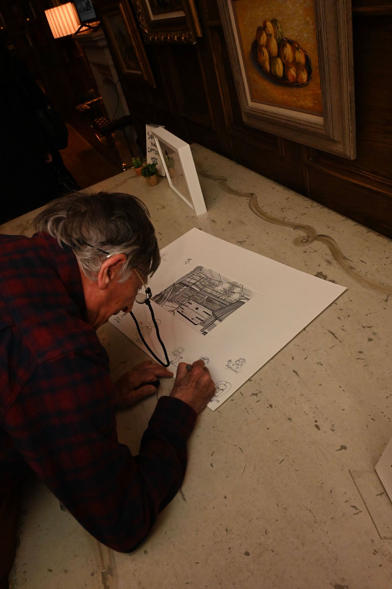 Legendary hands at work: Cartoonists leave their mark, sketching memories on a collaborative piece