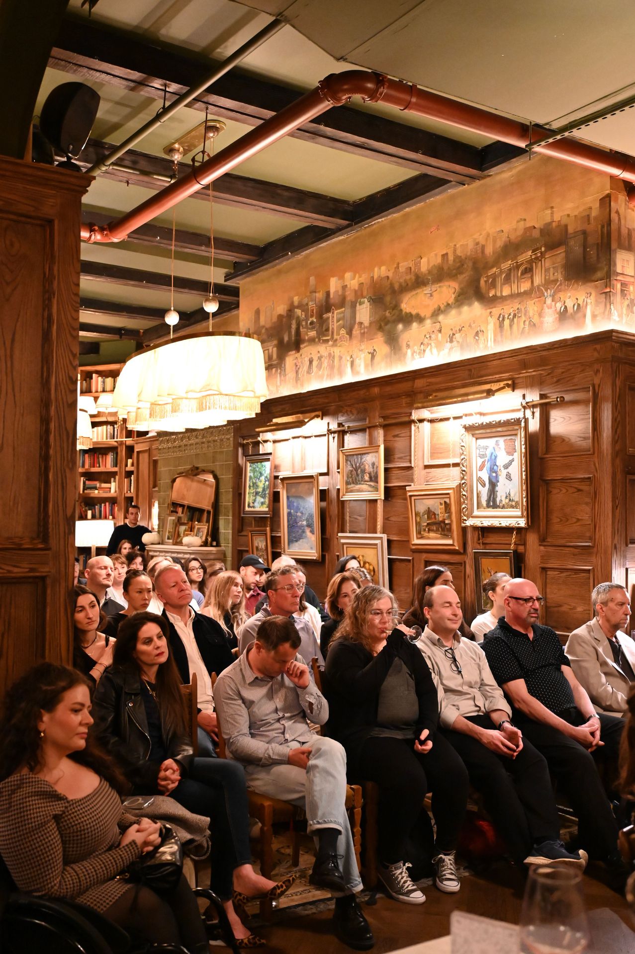 Guests listening closely as the discussion turns to free expression and the moral test of October 7