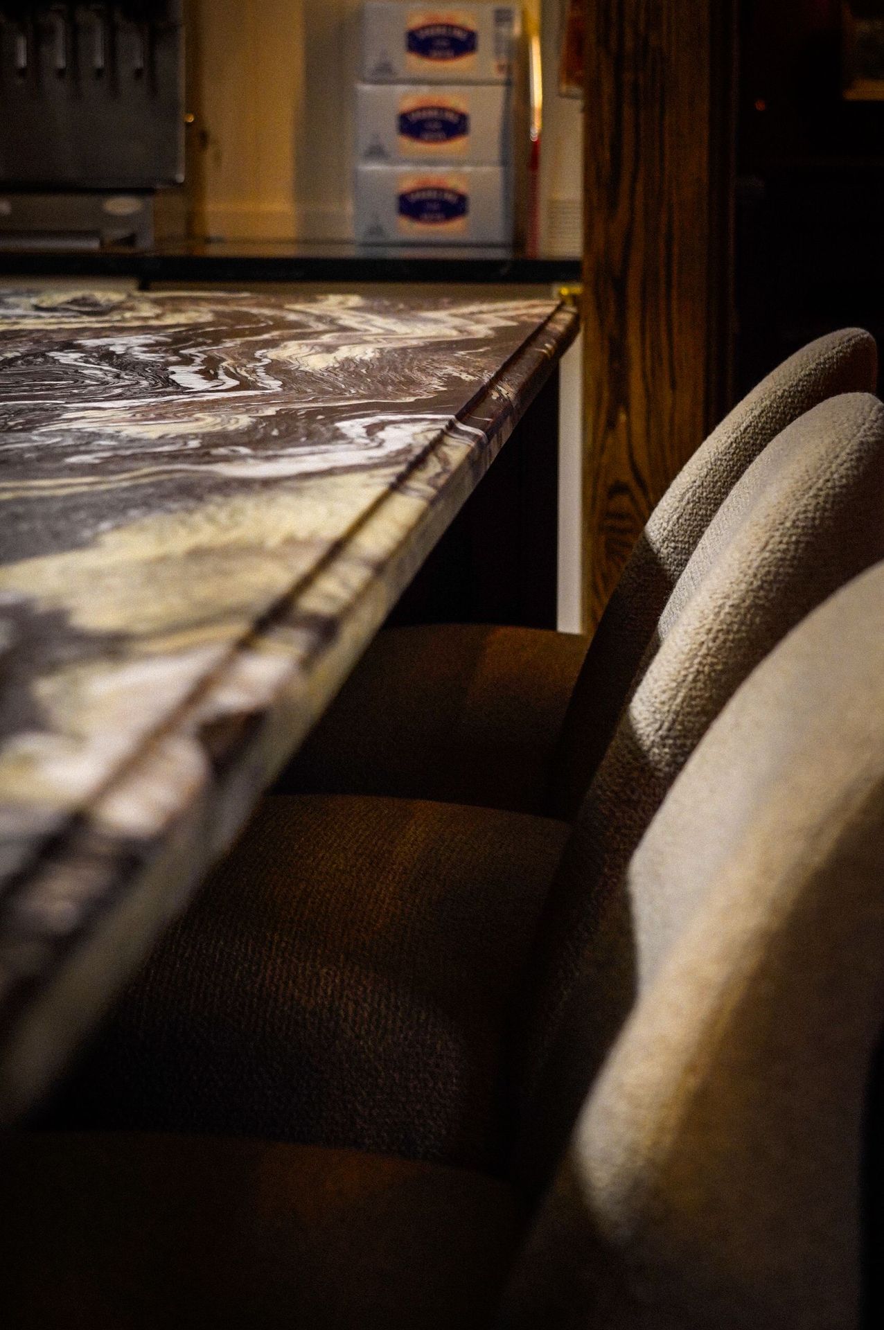 Beneath the dramatic stone top, Arhaus’s understated seating adds comfort while keeping the focus on the space, a quiet nod to their refined craftsmanship.