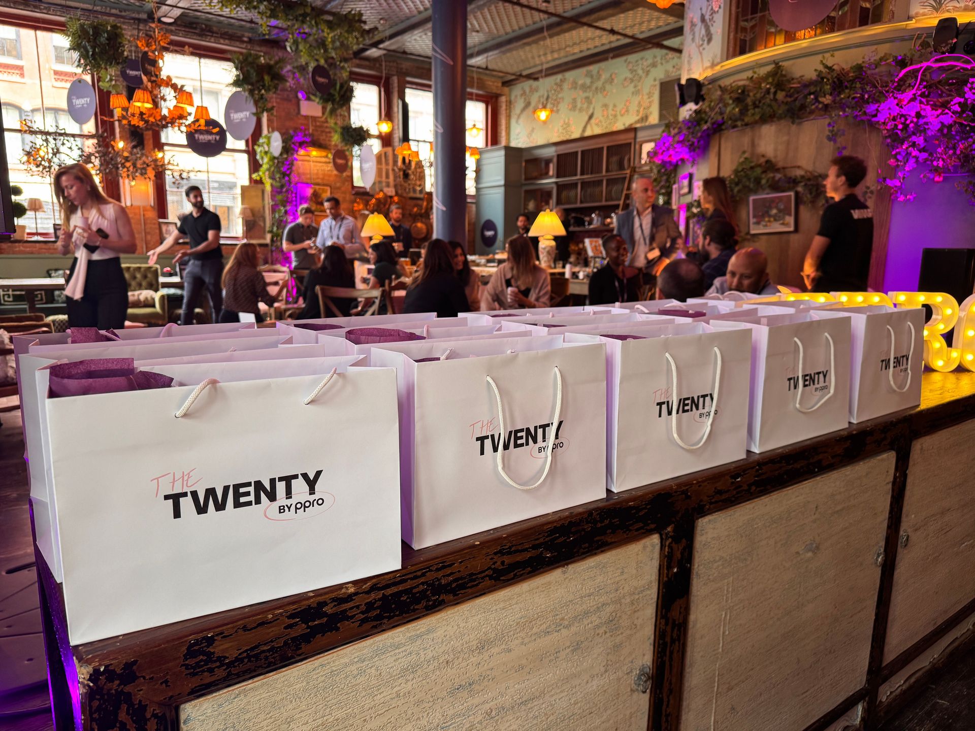 Branded gift bags lined up for attendees