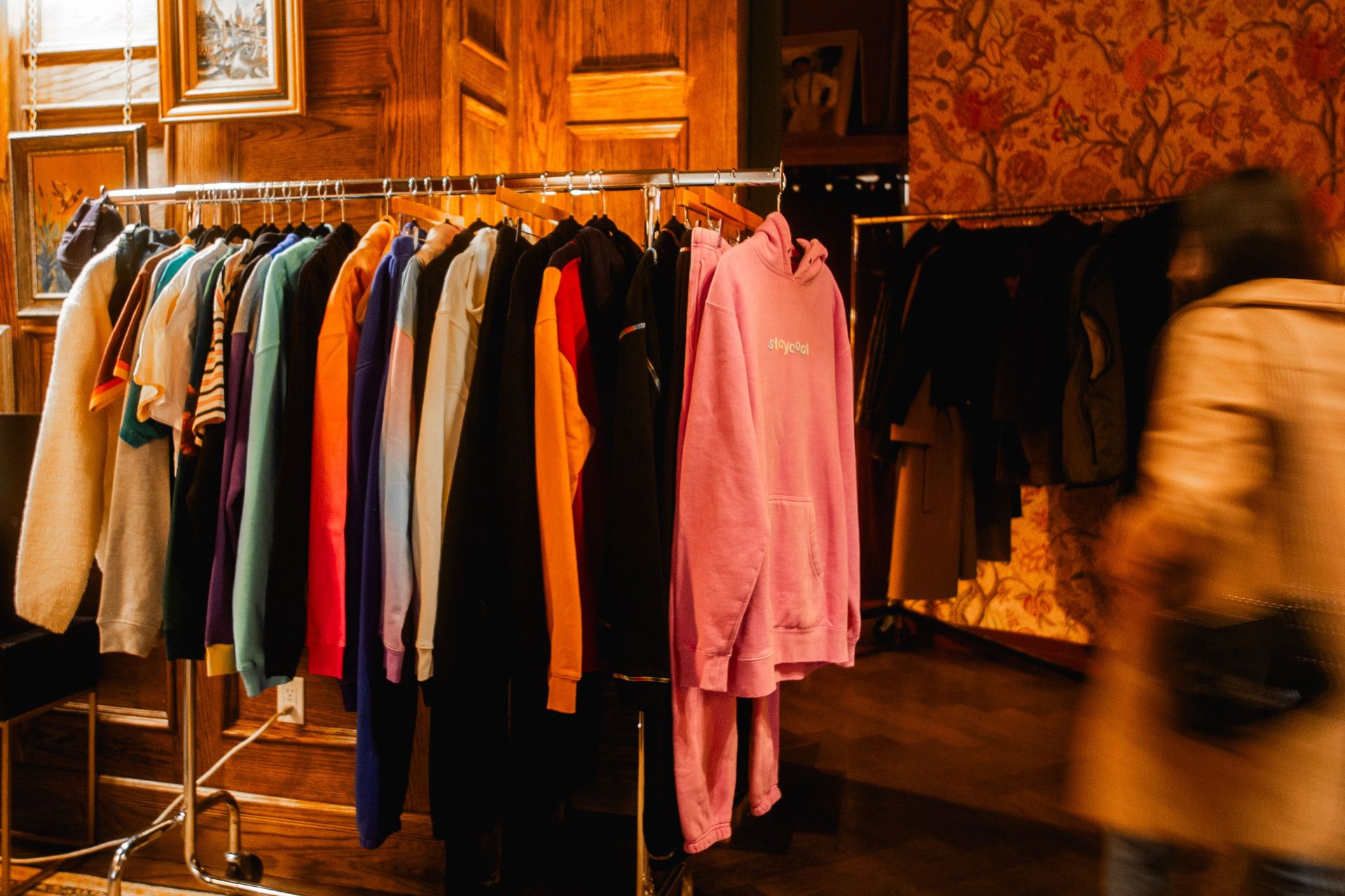 A curated rack of bold colors blend casual comfort with Maxwell’s signature style