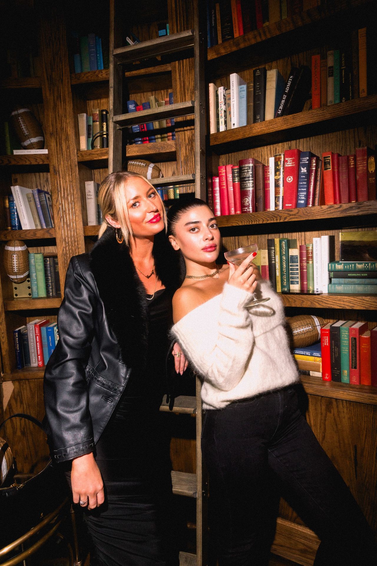 A toast between plays, where the Library’s shelves create the perfect backdrop for game-day camaraderie.
