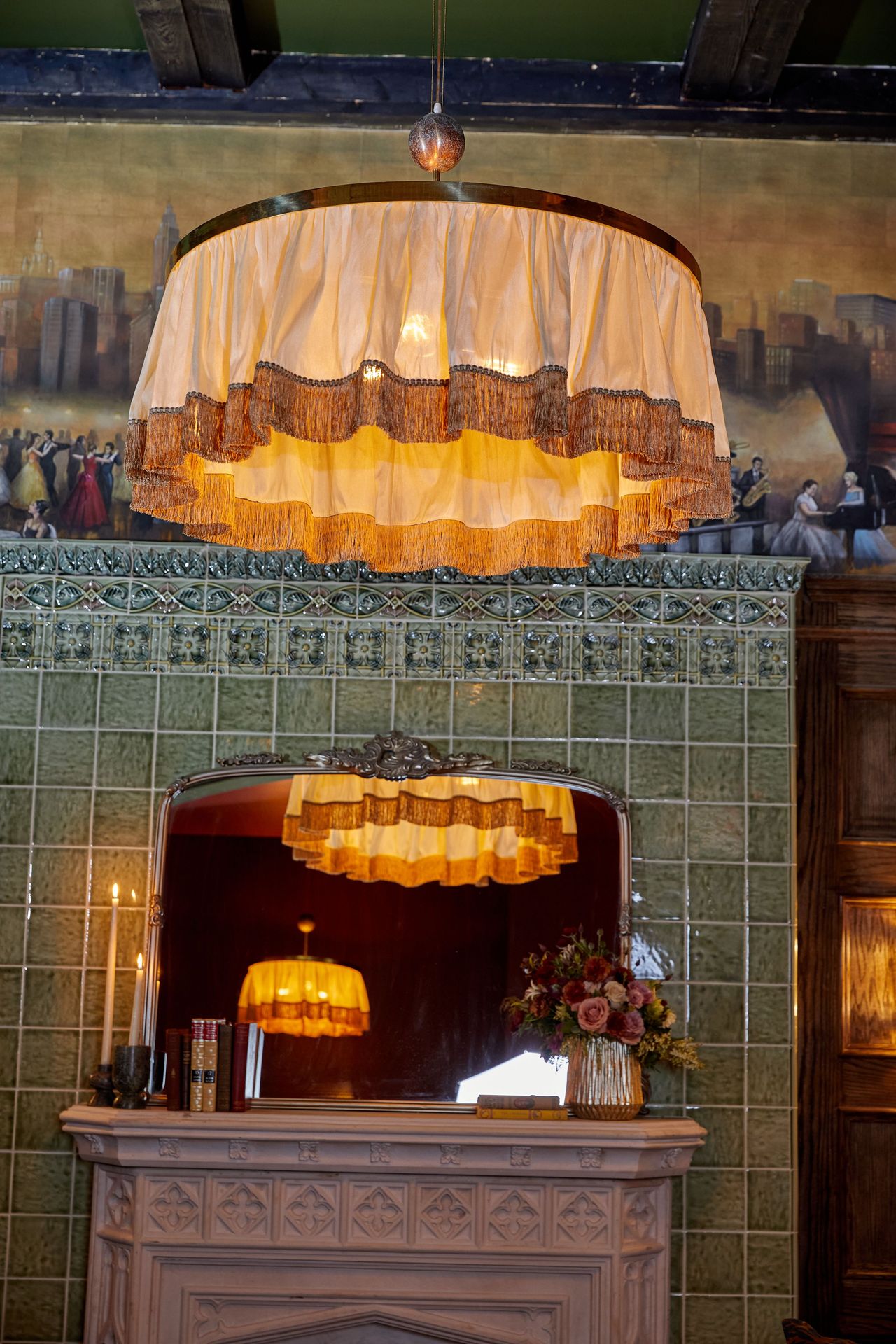 Seen straight on, the layered fabric and fringe create depth without pulling focus from the room itself