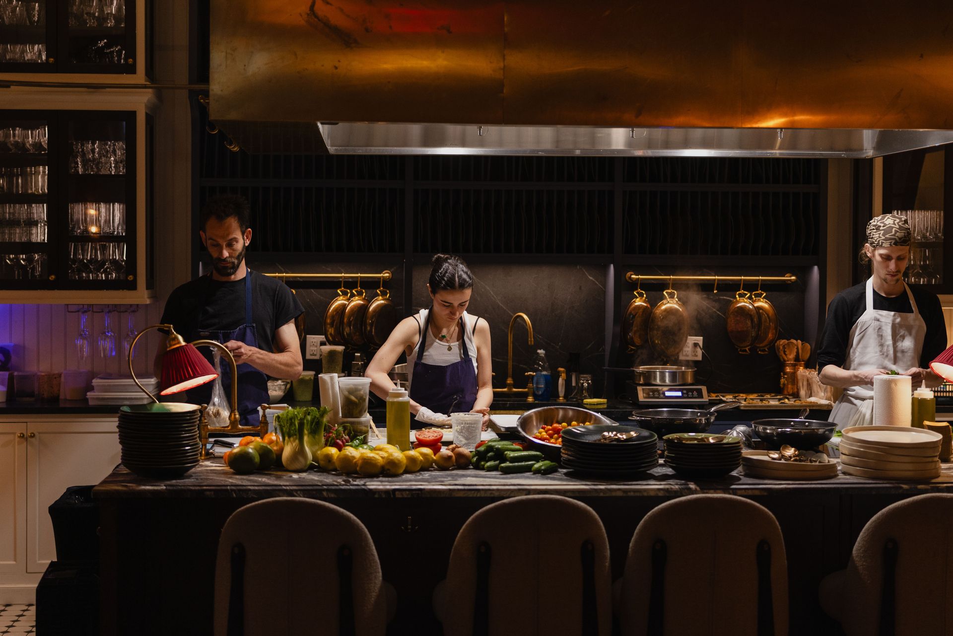 Chefs at work in the kitchen preparing the evening’s menu and setting the tone for a memorable dining experience