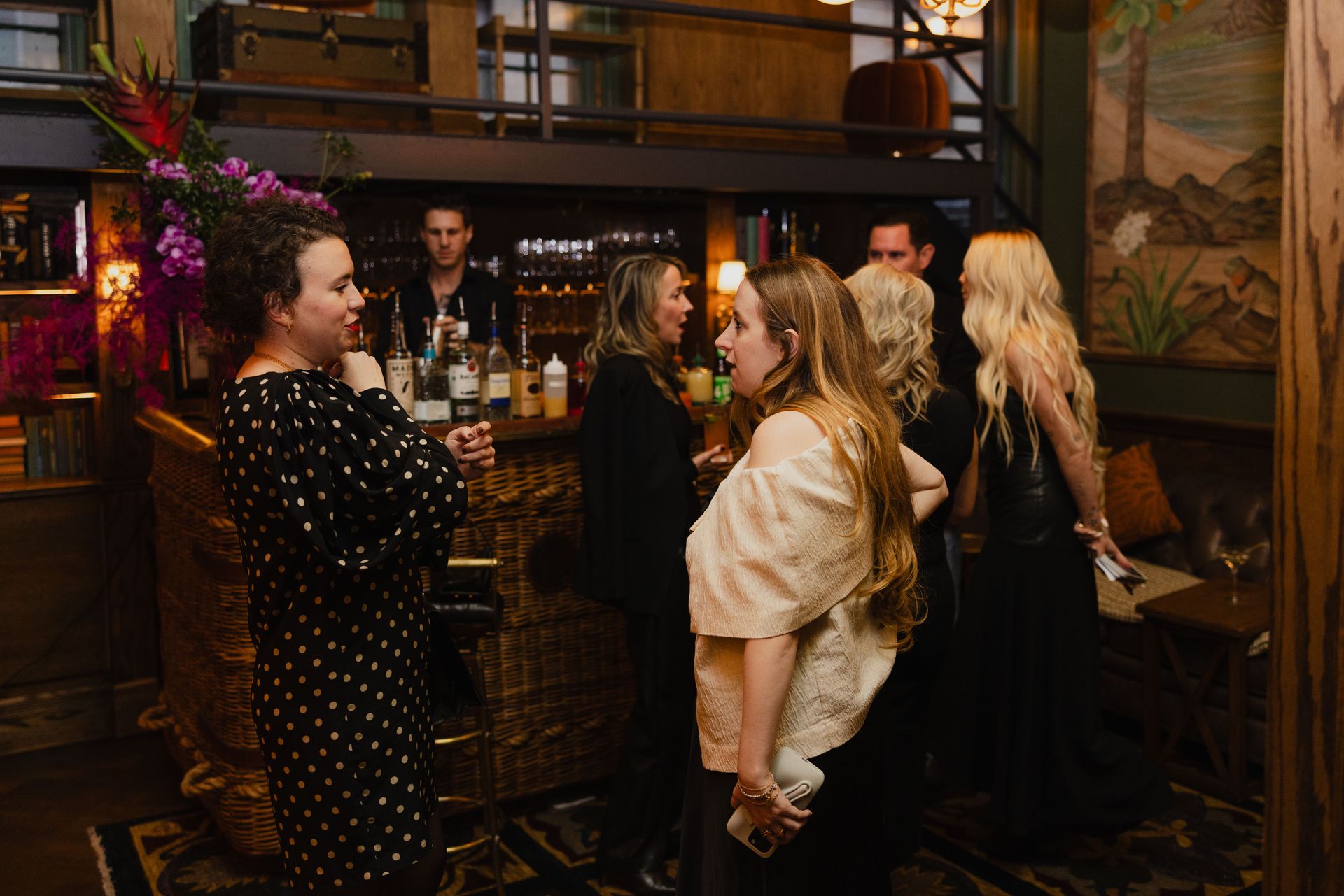Guests chat and sip drinks in a relaxed setting