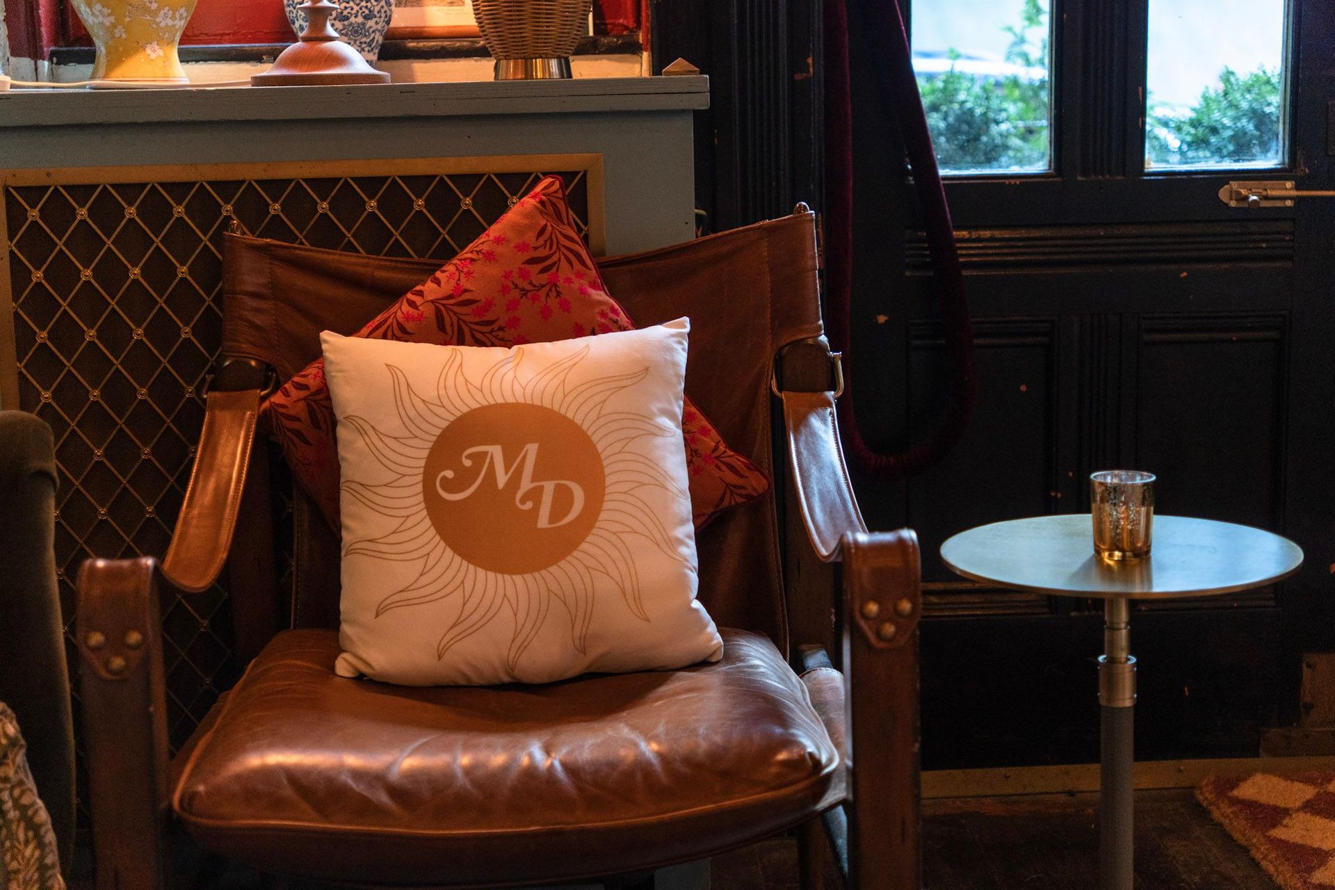 Custom pillows bring the couple’s initials into the decor, adding warmth and intimacy to the lounge seating.